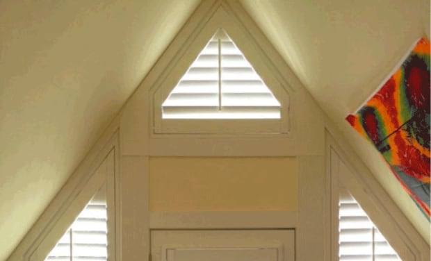 Triangle shaped window with plantation shutters